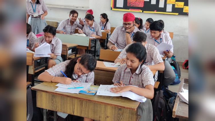 Students taking an offline exam in 2019